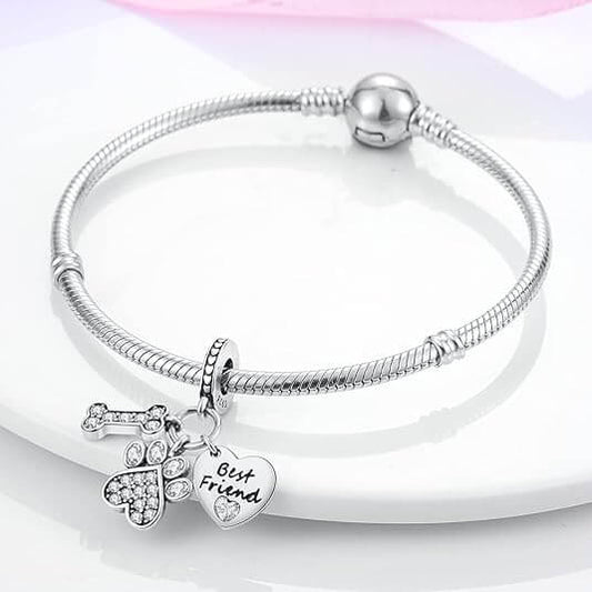 Sterling silver charm with crystal bone, crystal paw print, and ‘Best Friend’ heart