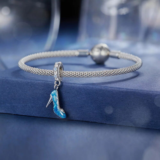 Sterling silver high heel charm with blue enamel and crystal accents.