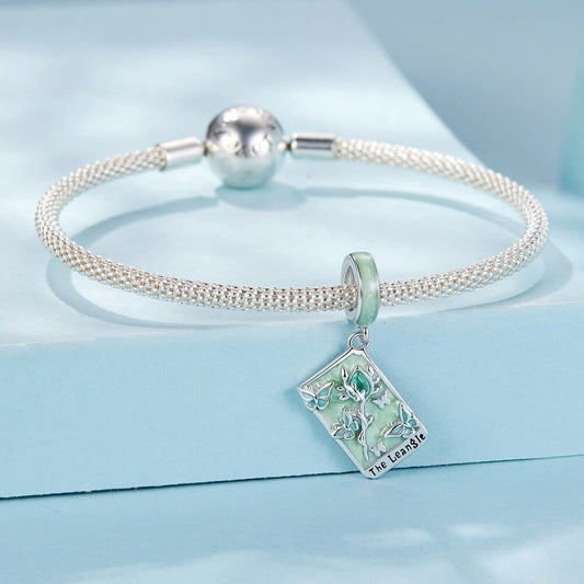 Sterling silver tarot card charm with butterflies, green enamel, and crystal rose.