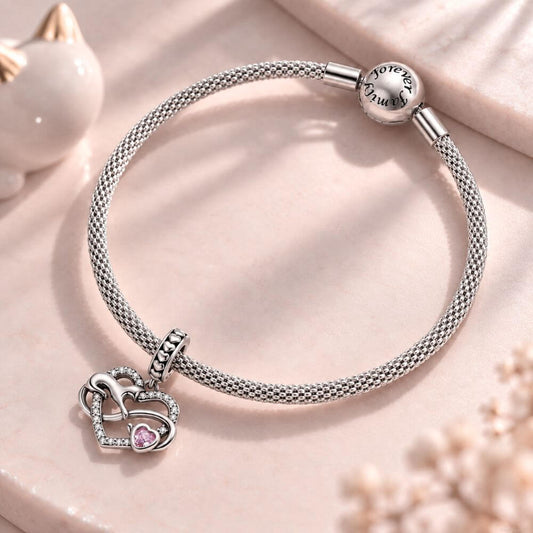 Sterling silver cat heart charm with infinity design, sparkling crystals, and a pink heart stone accent.