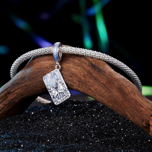 Sterling silver tarot card charm with horses, blue enamel, and opal crystal.