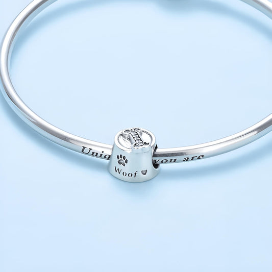 Sterling silver dog bowl charm with paw print and bone detail