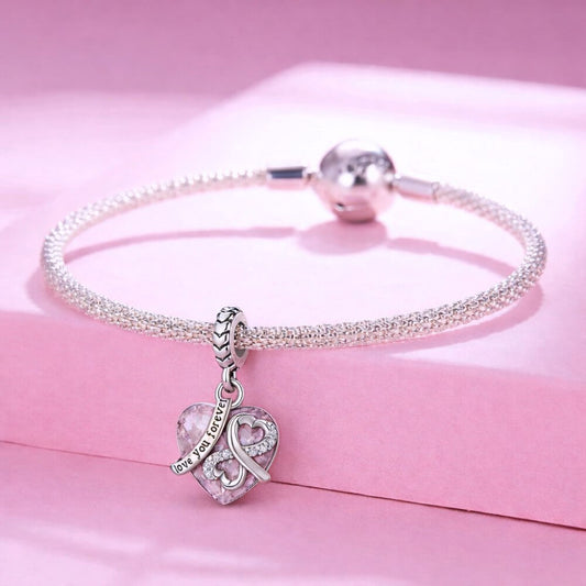 Sterling silver pink heart charm with infinity symbol and love you forever engraving.