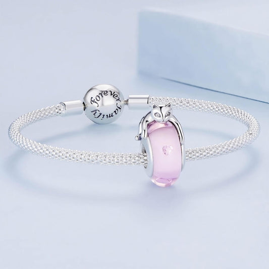 Sterling silver cat charm with pink crystal body and heart detail.
