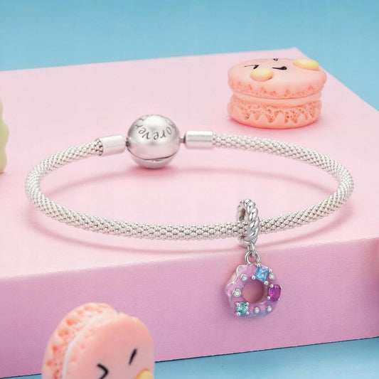 Sterling silver donut charm with pink frosting, colorful crystal sprinkles, and a twisted silver bail.