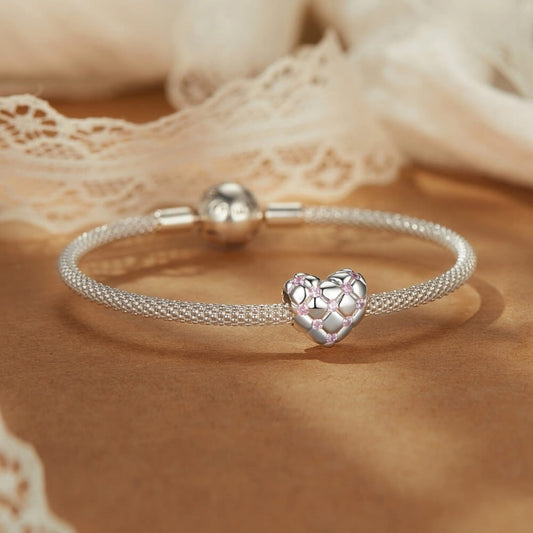 Sterling silver heart charm with pink crystals and quilted padded design.