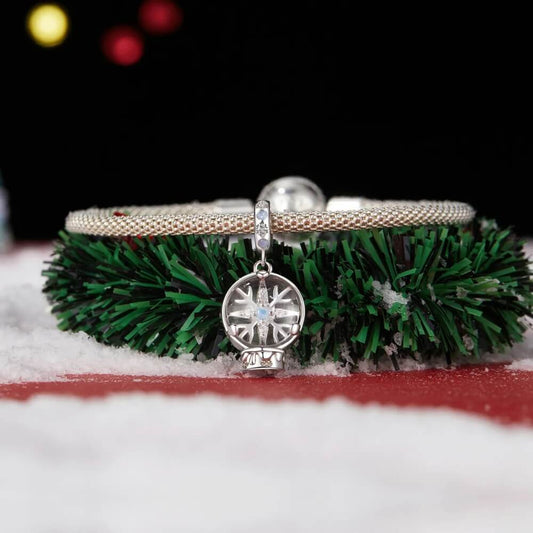 Sterling silver snow globe charm with snowflake and opal crystal.