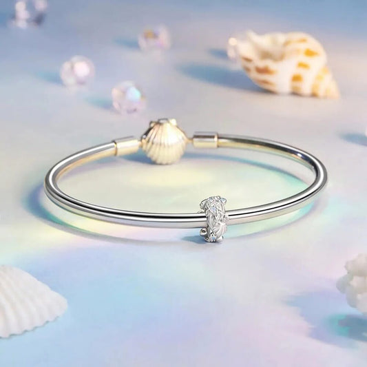 Sterling silver ocean charm with starfish and opal crystal accents.
