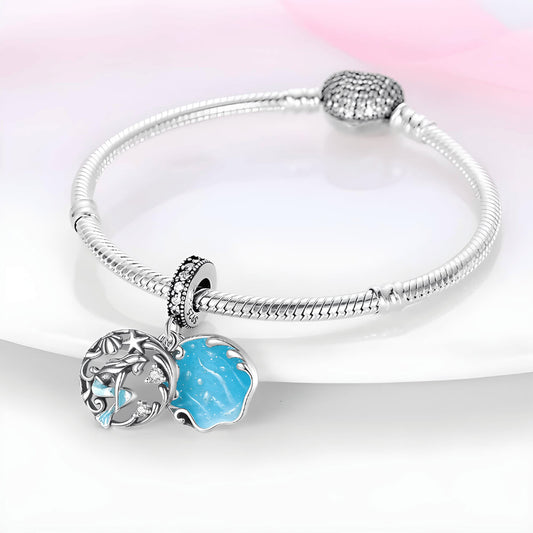 Sterling silver double dangle mermaid charm with blue enamel wave disc and gemstones.