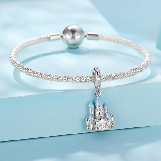 Sterling silver winter castle charm with icy blue enamel rooftops.