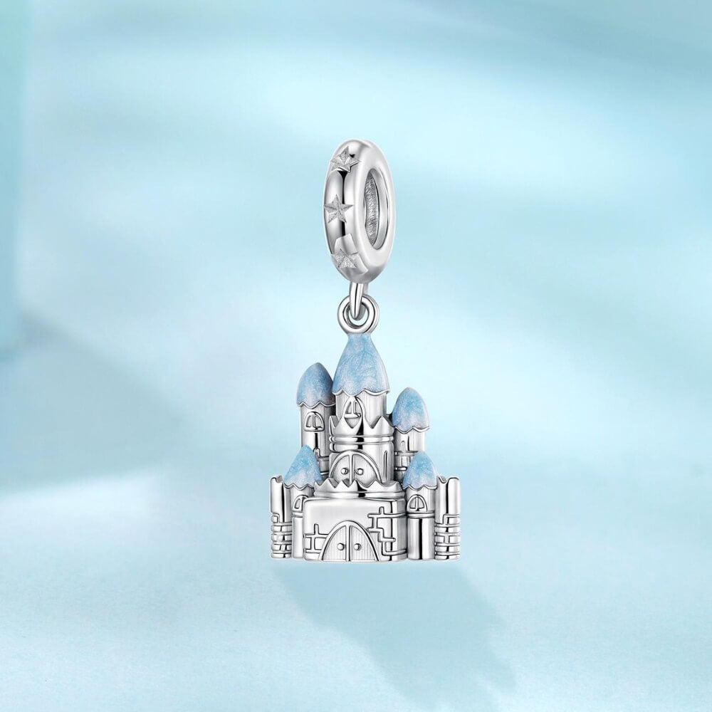 Sterling silver winter castle charm with icy blue enamel rooftops.
