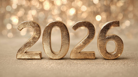 Gold 2026 numbers on a sparkling background representing upcoming jewelry trends