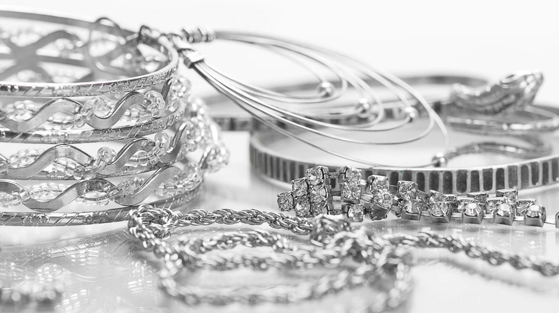 Selection of silver jewelry including bracelets, bangles, and chains