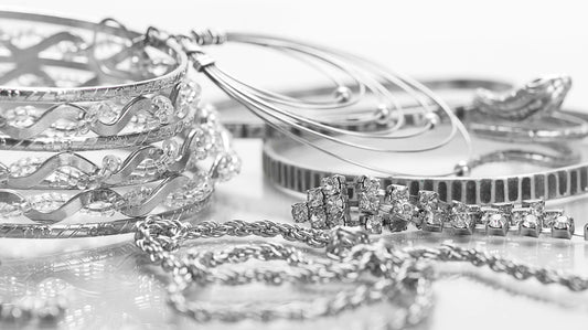 Selection of silver jewelry including bracelets, bangles, and chains