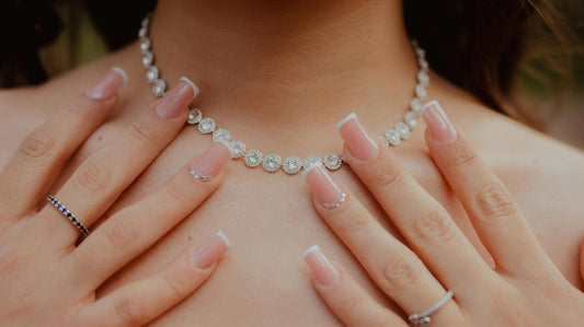 Woman wearing a delicate necklace, symbolizing self expression and personal growth through jewelry
