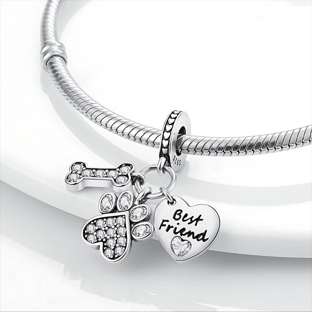 Sterling silver charm with crystal bone, crystal paw print, and ‘Best Friend’ heart 