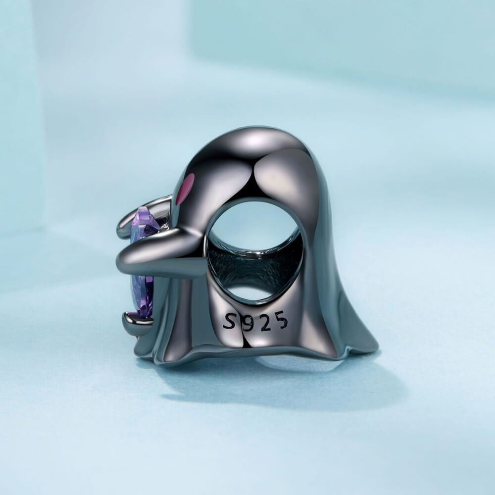 Black ghost charm holding purple heart crystal in sterling silver style.