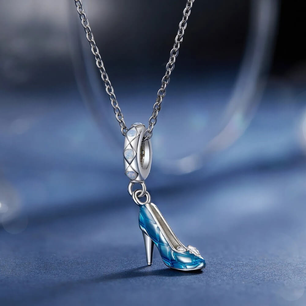 Sterling silver high heel charm with blue enamel and crystal accents.