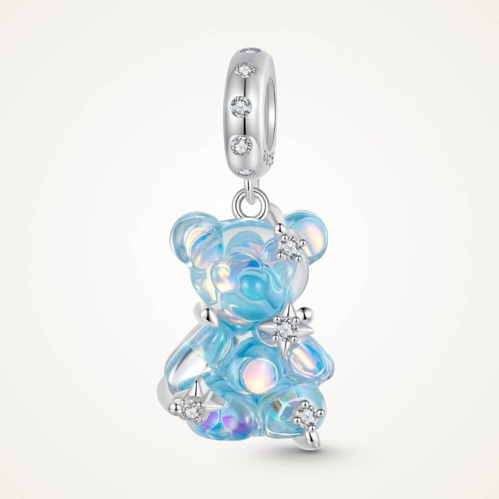 Blue teddy bear charm with iridescent finish and sparkling star details - ORÉYA