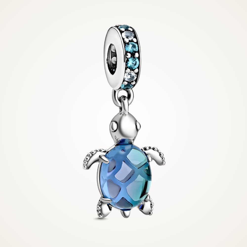 Sterling silver sea turtle charm with blue faceted shell and blue gemstone bail - ORÉYA