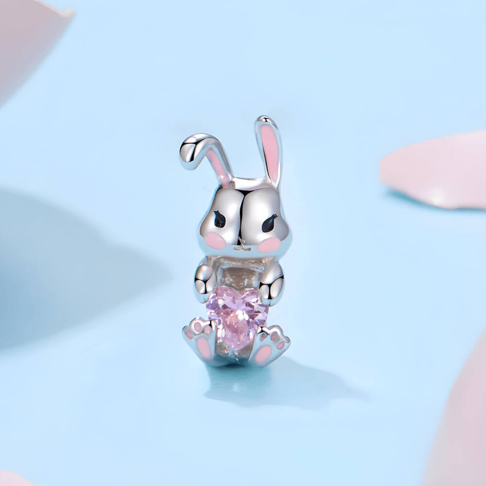 Sterling silver bunny charm with pink enamel accents and pink heart-shaped crystal 