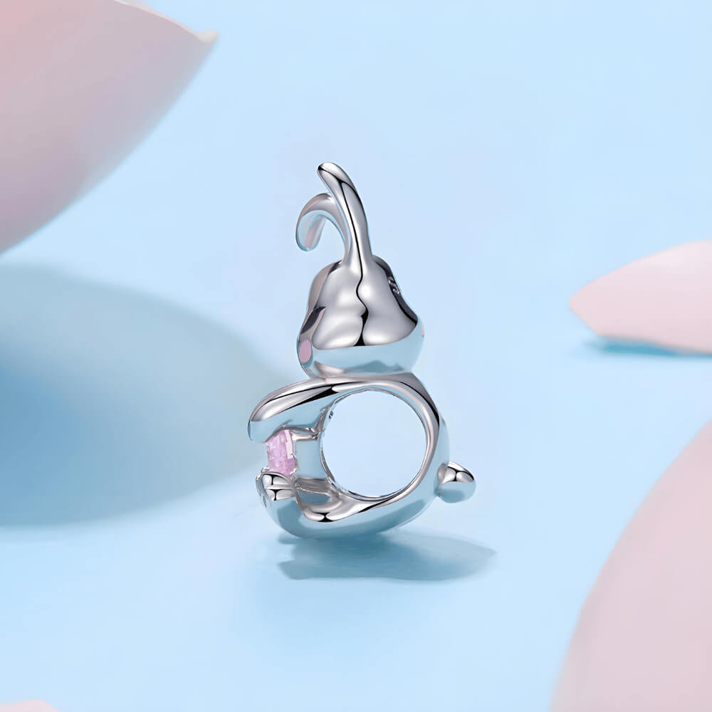Sterling silver bunny charm with pink enamel accents and pink heart-shaped crystal