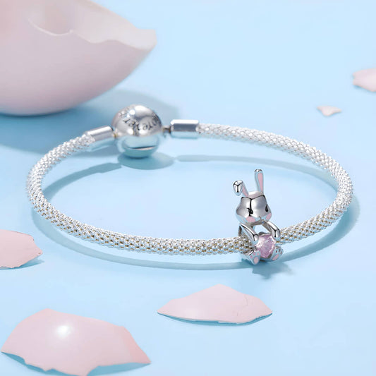 Sterling silver bunny charm with pink enamel accents and pink heart-shaped crystal 