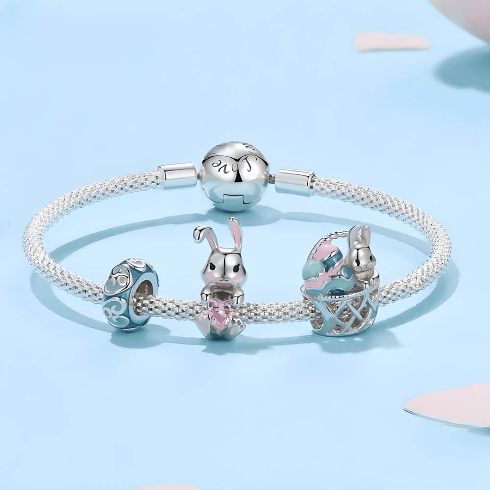 Sterling silver bunny charm with pink enamel accents and pink heart-shaped crystal 