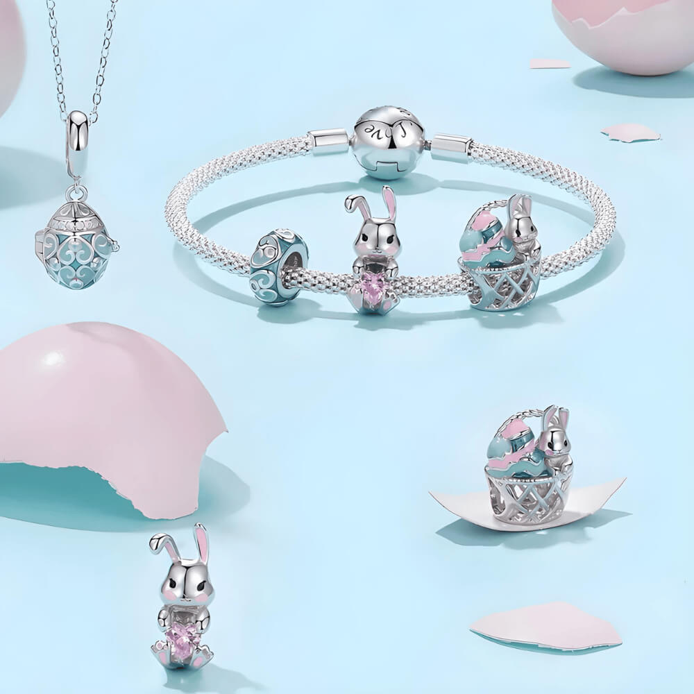 Sterling silver bunny charm with pink enamel accents and pink heart-shaped crystal 