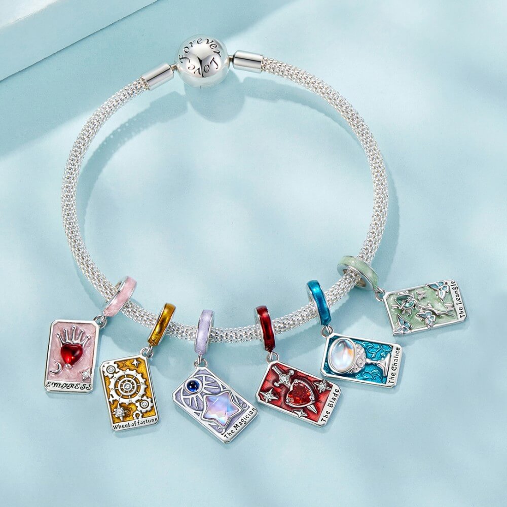 Sterling silver tarot card charm with butterflies, green enamel, and crystal rose.