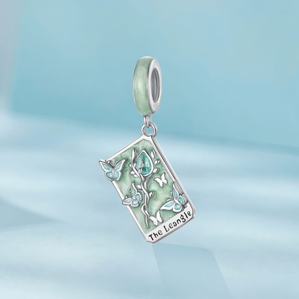 Sterling silver tarot card charm with butterflies, green enamel, and crystal rose.