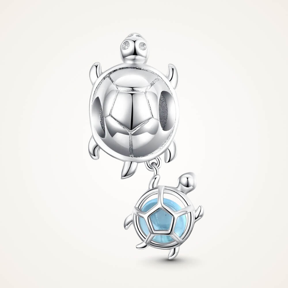 Sterling silver turtle charm with baby turtle detail and soft blue glass accent - ORÉYA