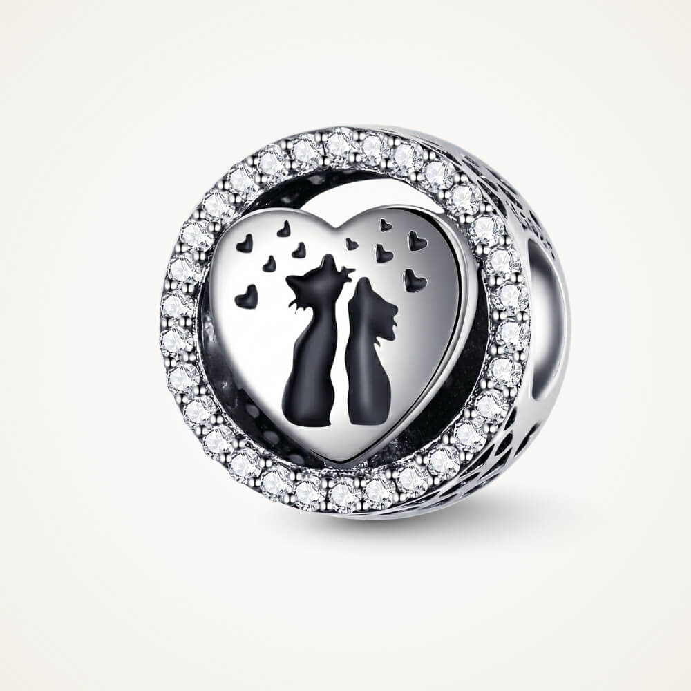 Sterling silver cat heart charm with crystal border and black silhouettes.