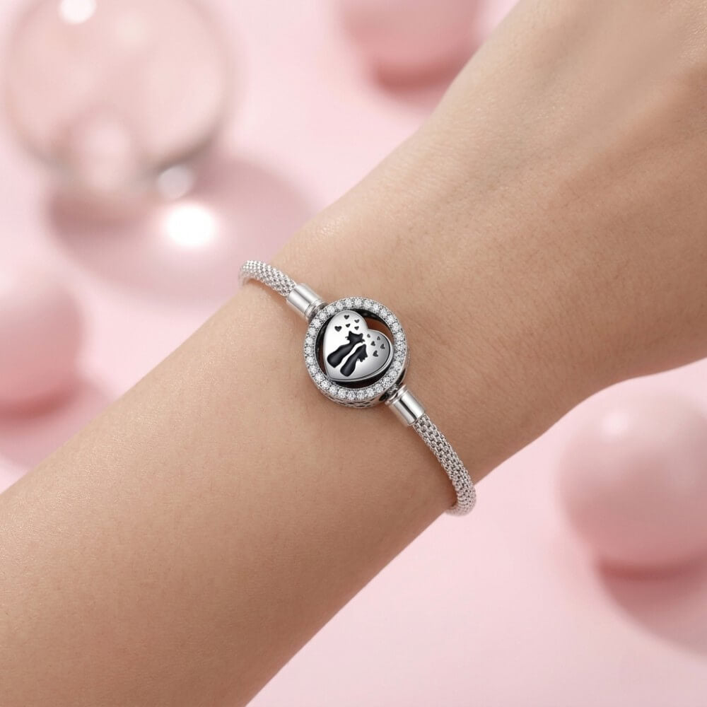 Sterling silver cat heart charm with crystal border and black silhouettes.