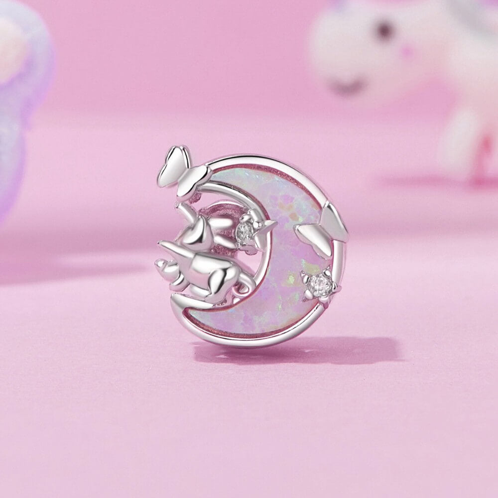 Sterling silver cat and moon charm with pink opal-like inlay and clear stones.
