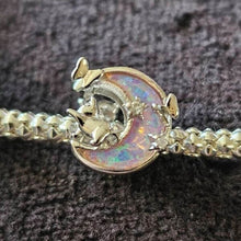 Sterling silver cat and moon charm with pink opal-like inlay and clear stones.
