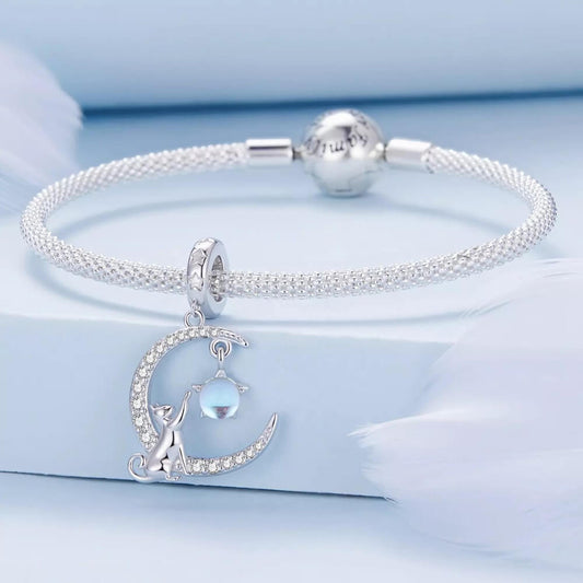 Sterling silver cat moon charm with star and opal crystal.