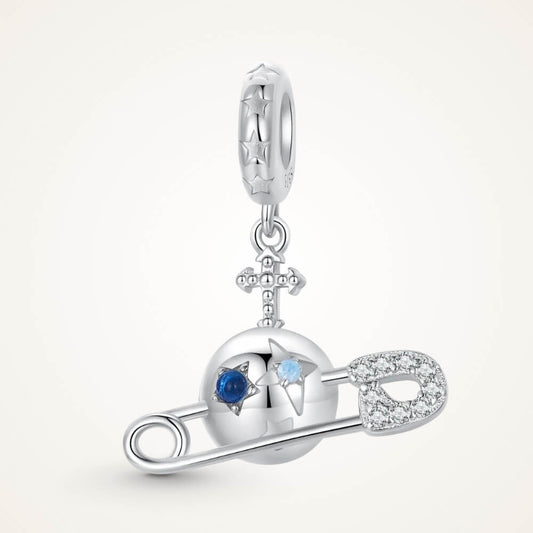 Sterling silver safety pin charm with stars, crystals, and celestial details.