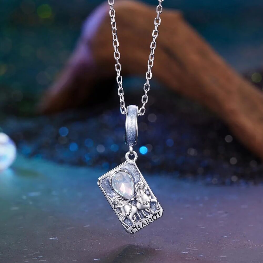 Sterling silver tarot card charm with horses, blue enamel, and opal crystal.
