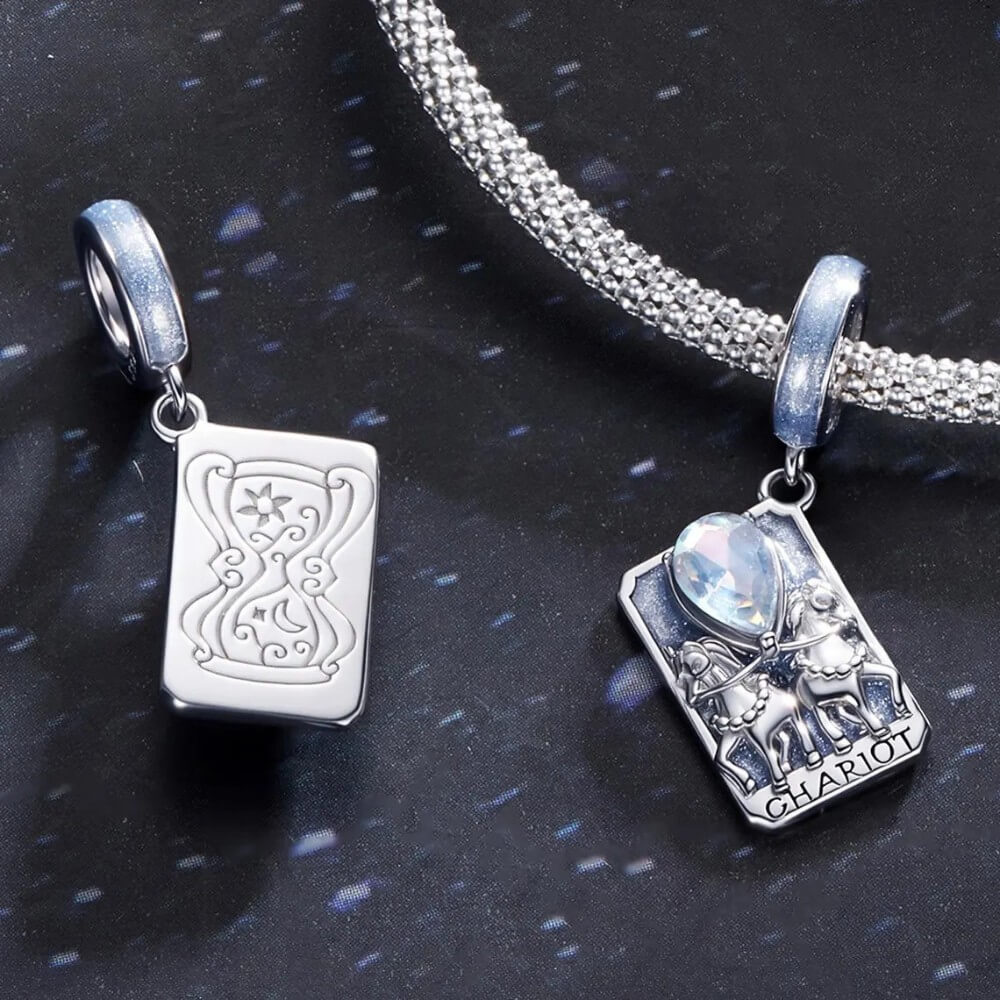 Sterling silver tarot card charm with horses, blue enamel, and opal crystal.