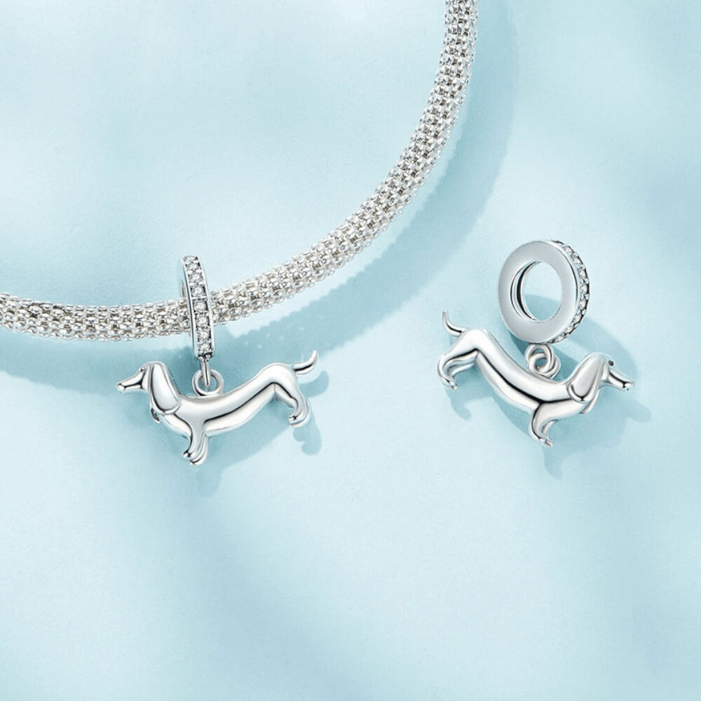 Sterling silver dachshund charm with long body and crystal-studded bail