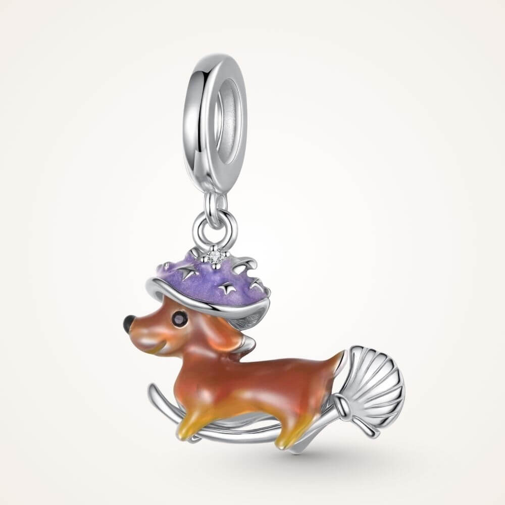 Sterling silver dachshund witch charm with purple hat, broomstick, and playful Halloween details - ORÉYA