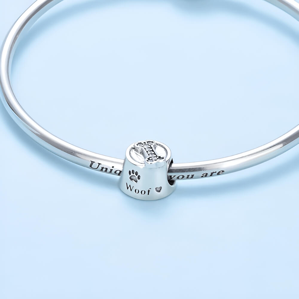 Sterling silver dog bowl charm with paw print and bone detail 