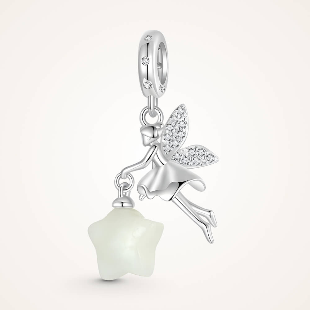 Sterling silver fairy charm holding glowing star with crystal wing details - ORÉYA