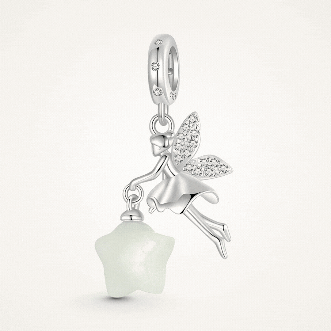 Sterling silver fairy charm holding glowing star with crystal wing details - ORÉYA