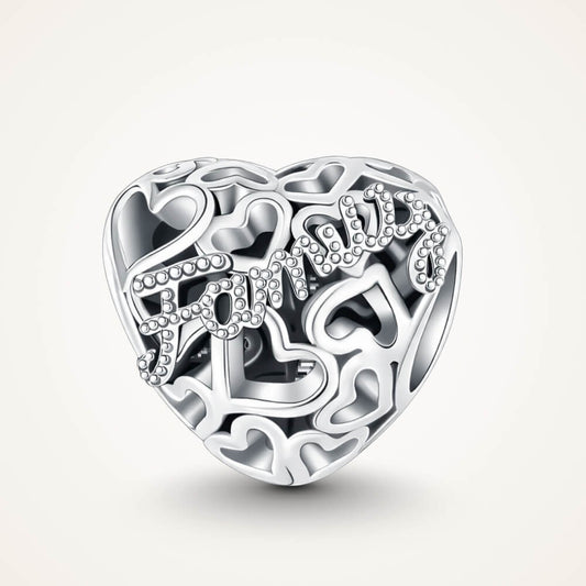 Sterling silver heart charm with Family text and cutout hearts - ORÉYA