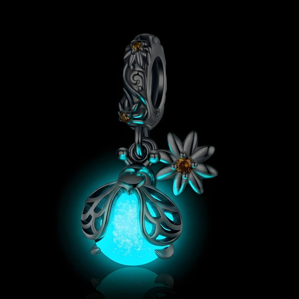 Sterling silver firefly charm with mint glowing enamel body and yellow flower detail - ORÉYA