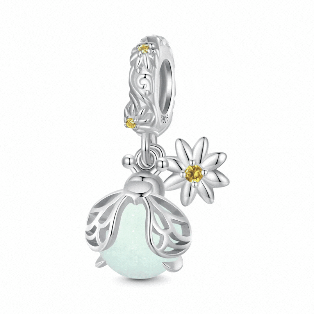 Sterling silver firefly charm with mint glowing enamel body and yellow flower detail - ORÉYA