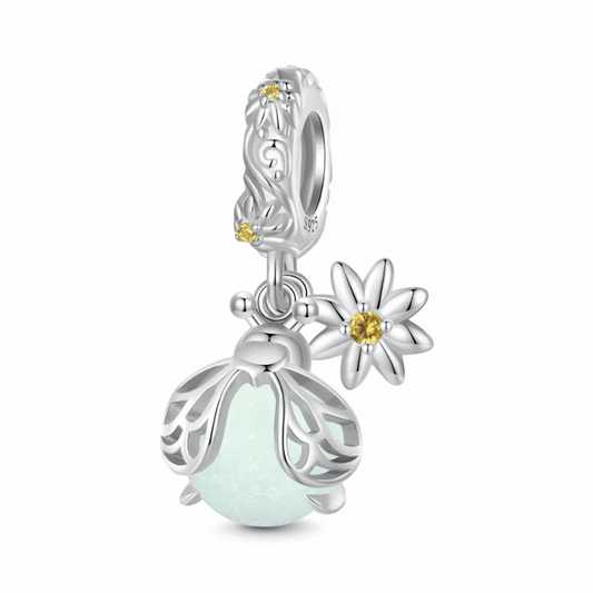Sterling silver firefly charm with mint glowing enamel body and yellow flower detail - ORÉYA