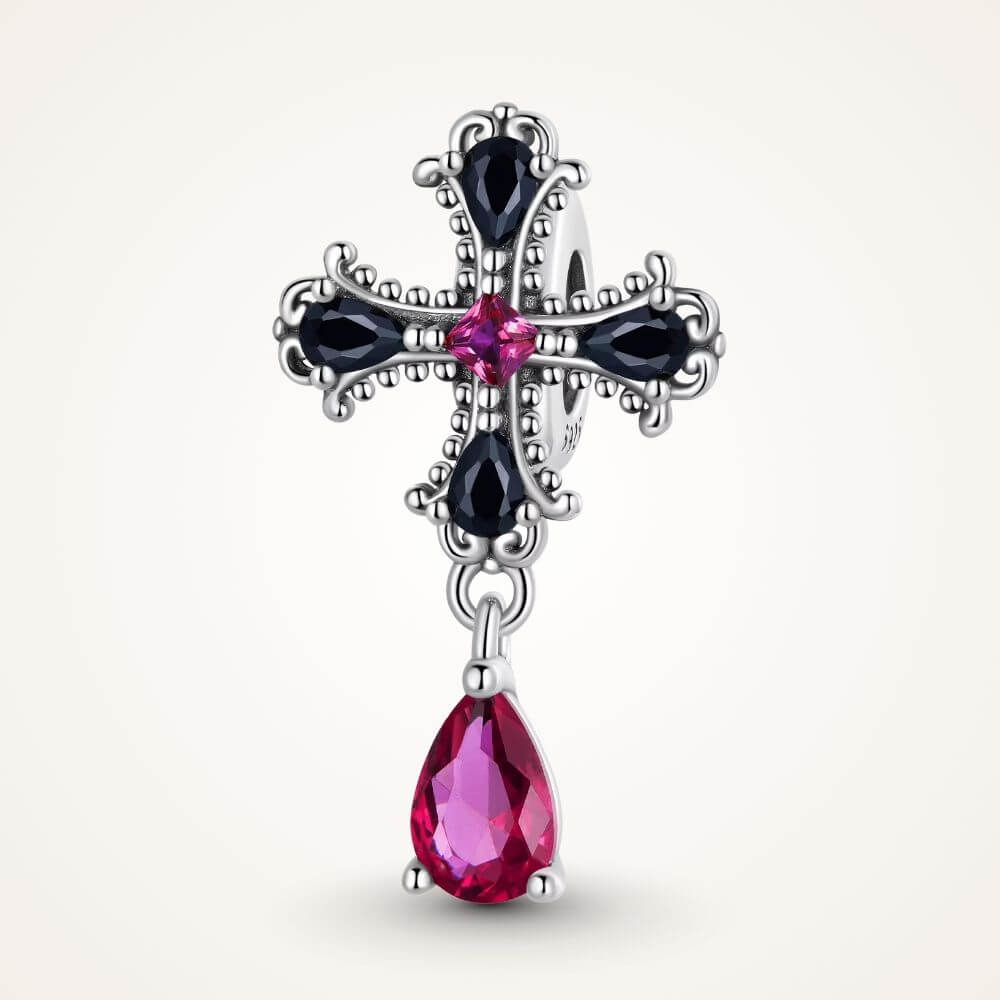 Sterling silver gothic cross charm with black crystals, pink center stone, and dangling magenta crystal drop - ORÉYA
